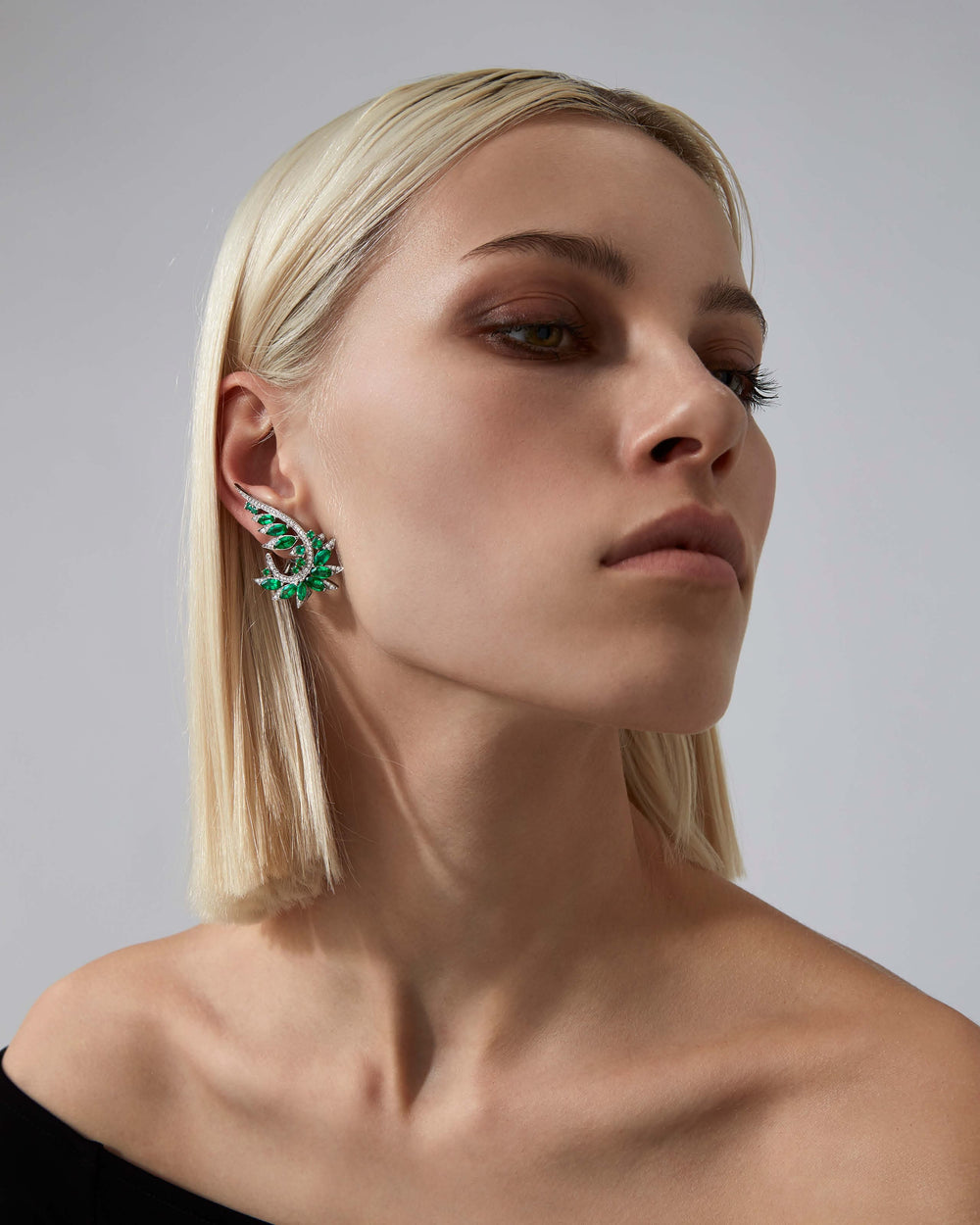 White Gold and Emerald Plumage Earrings in 18ct white gold with marquise emeralds and white diamond pavé