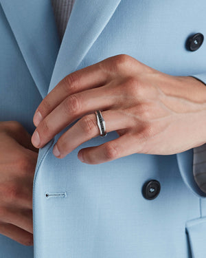 White gold Quadrafoil black round diamond men’s wedding band worn on hand