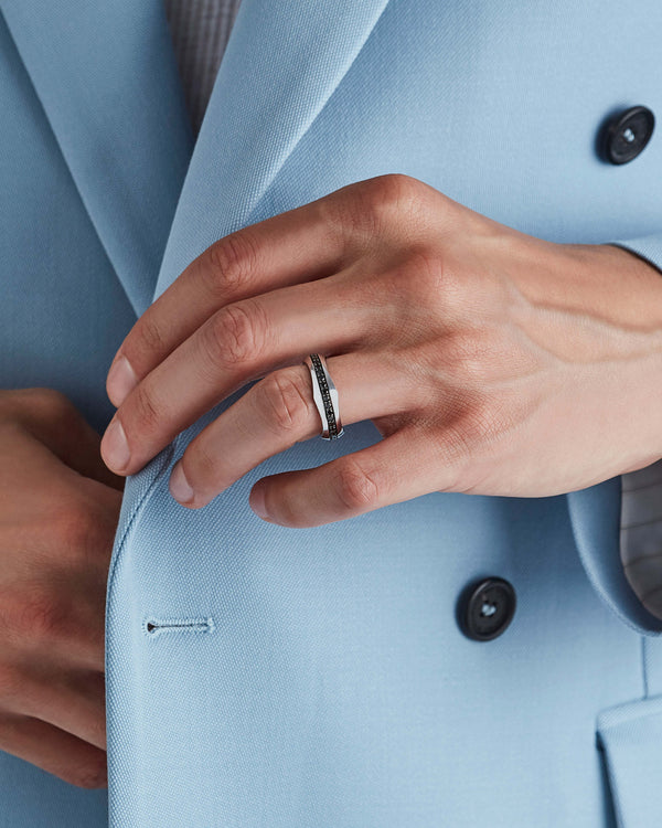 White gold Quadrafoil black round diamond men’s wedding band worn on hand