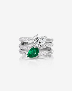 Women’s 18ct white gold Opposites Attract ring with pear diamond and emerald, white diamond pavé