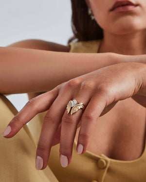 Model wearing 18ct yellow gold Magnipheasant diamond nesting ring on hand