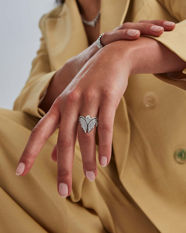 Model wearing white gold Magnipheasant solitaire ring with white diamond