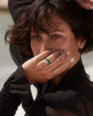Model wearing 18ct white gold Opposites Attract black and white diamond ring