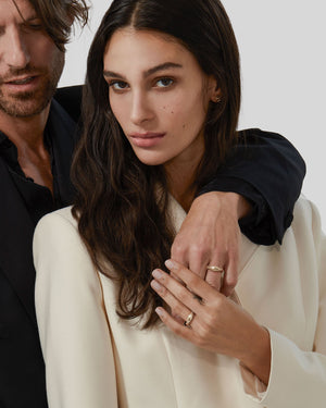 Unisex serpentine yellow gold wedding band with sculptural twist design