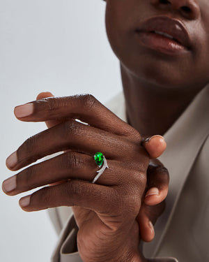 Model wearing 18ct white gold Thorn Floating Emerald Solitaire ring
