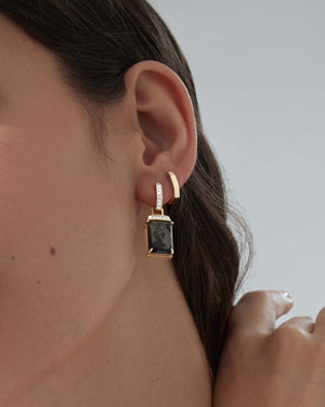 Yellow gold sleepers earrings styled with other Stephen Webster jewellery